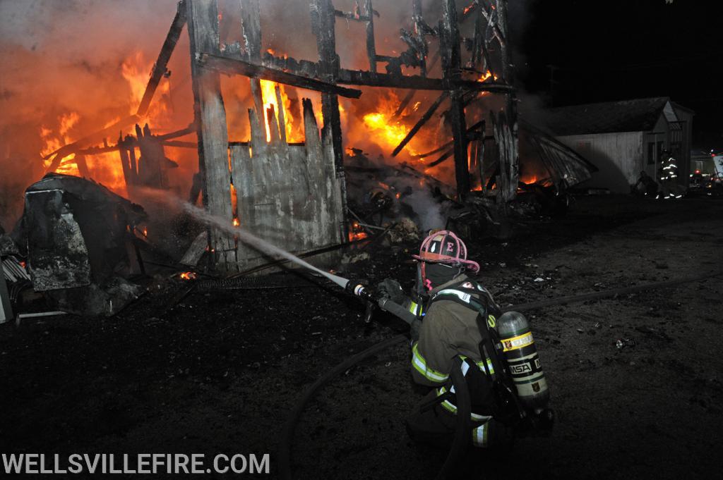 July 4, Saturday, barn fire on North Street in Wellsville.  photos by curt werner