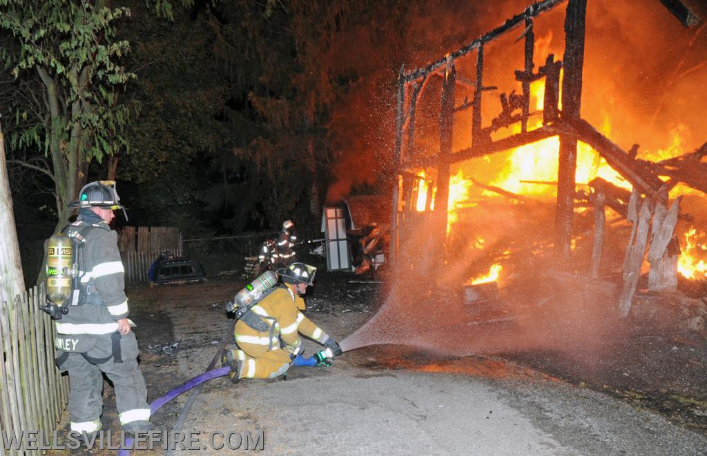 July 4, Saturday, barn fire on North Street in Wellsville.  photos by curt werner