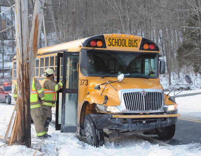 School bus slides into telephone pole.  photos by Curt Werner