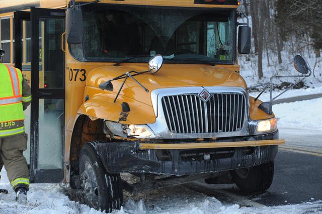 School bus slides into telephone pole.  photos by Curt Werner