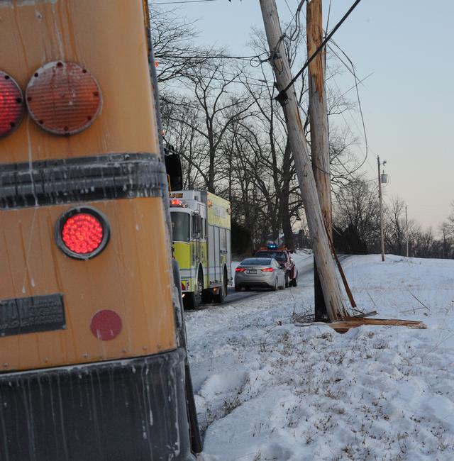 School bus slides into telephone pole.  photos by Curt Werner