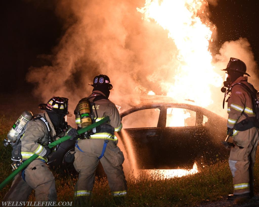 08/18/18, car fire on Old York Road early in morning, :56 a.m.  Wellsville firefighters attack blaze.  photos by curt werner