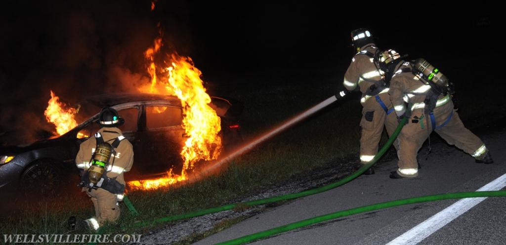 08/18/18, car fire on Old York Road early in morning, :56 a.m.  Wellsville firefighters attack blaze.  photos by curt werner