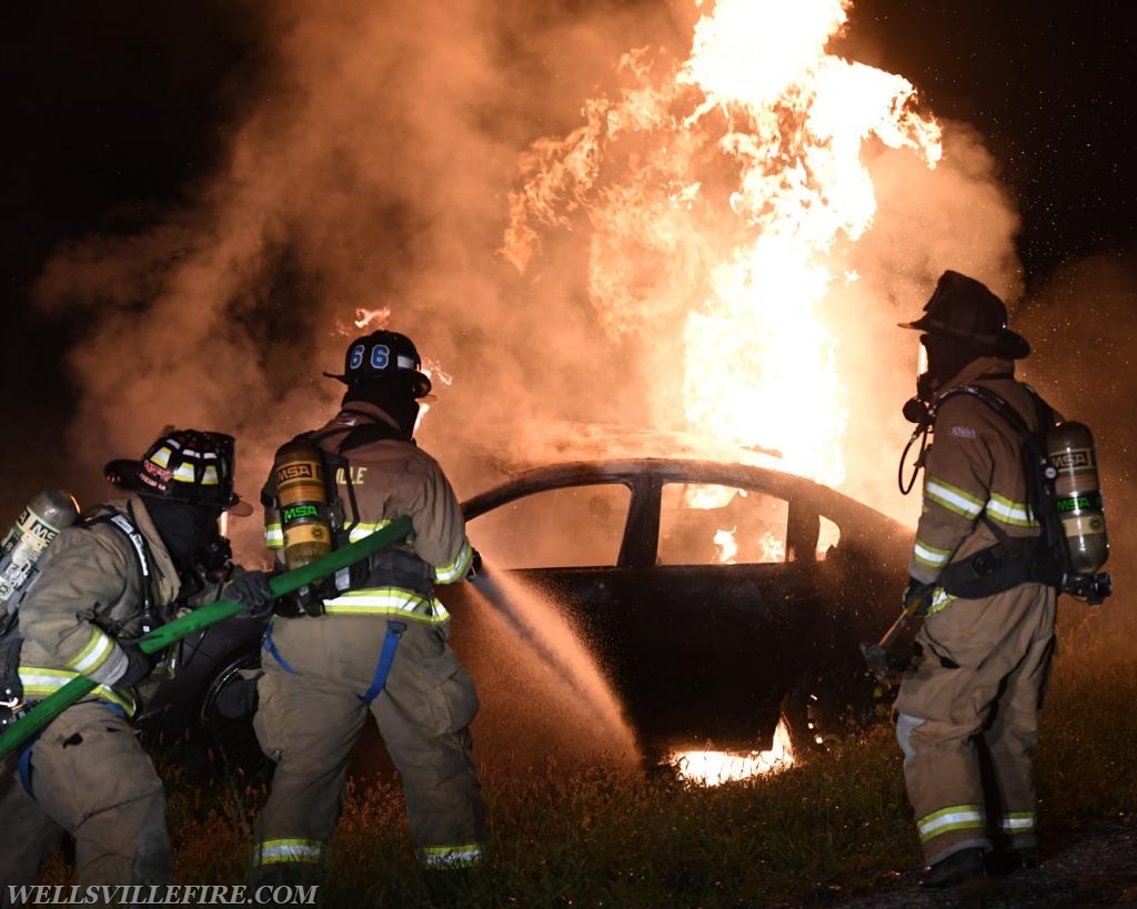 08/18/18, car fire on Old York Road early in morning, :56 a.m.  Wellsville firefighters attack blaze.  photos by curt werner