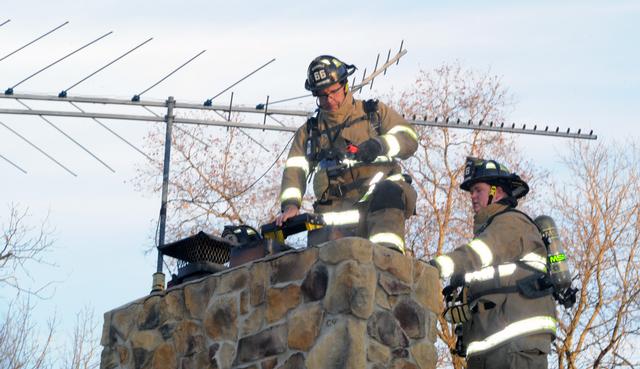 Chimney fire on Christmas morning.  Eighteen degrees.  Photos by Curt Werner