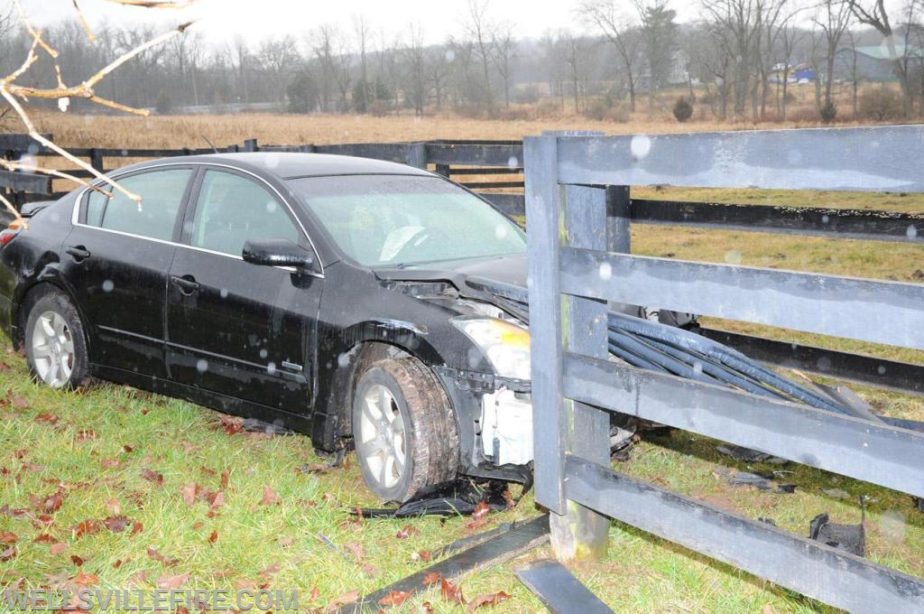 Saturday, January 5, car into fence off Wellsville Road.  photo by curt werner

