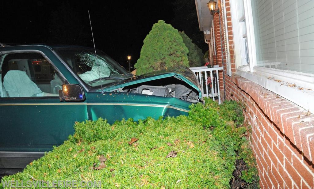 Friday night, August 23, vehicle into house on Wellsville Road.  photos by curt werner