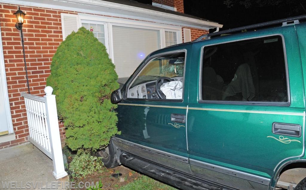 Friday night, August 23, vehicle into house on Wellsville Road.  photos by curt werner