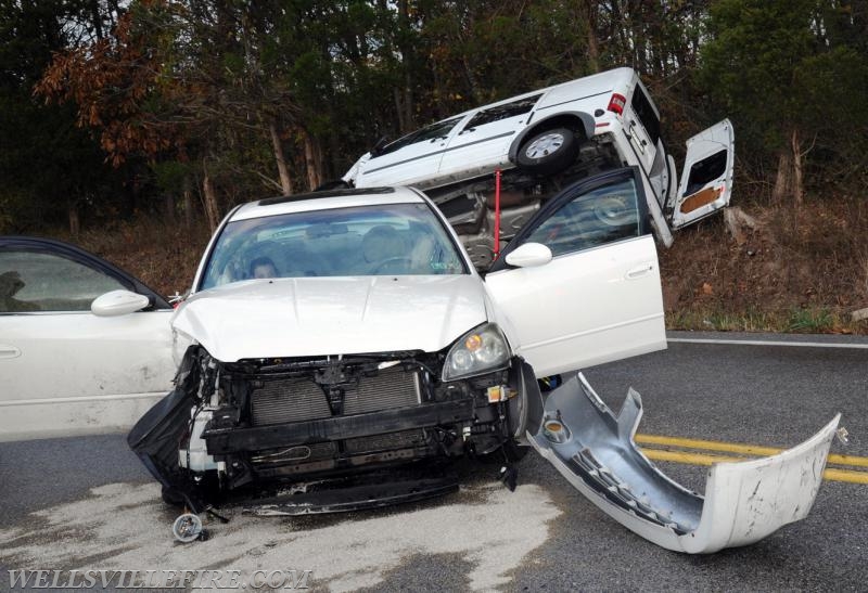 Two vehicle accident on Wellsville Road on 10/21/16.  Van on its side, driver entrapment.  photo by curt werner
