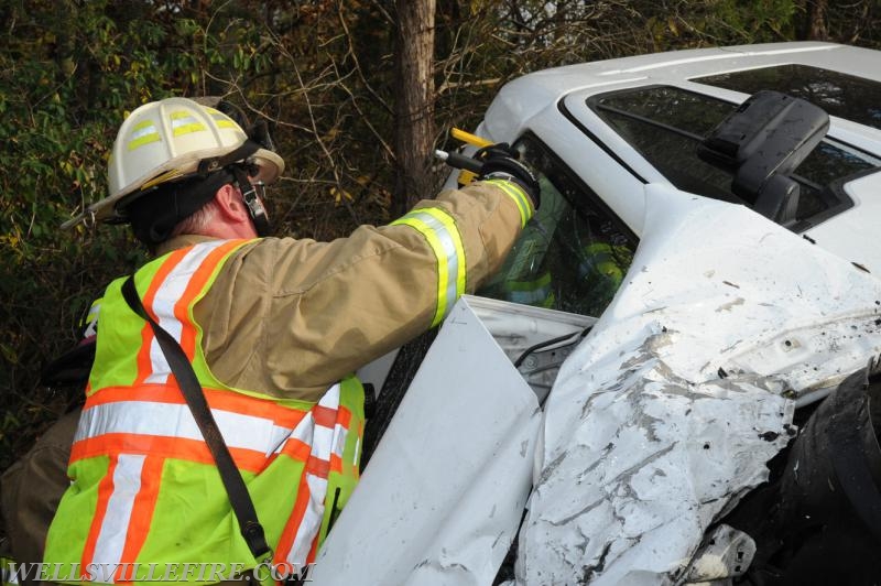 Two vehicle accident on Wellsville Road on 10/21/16.  Van on its side, driver entrapment.  photo by curt werner