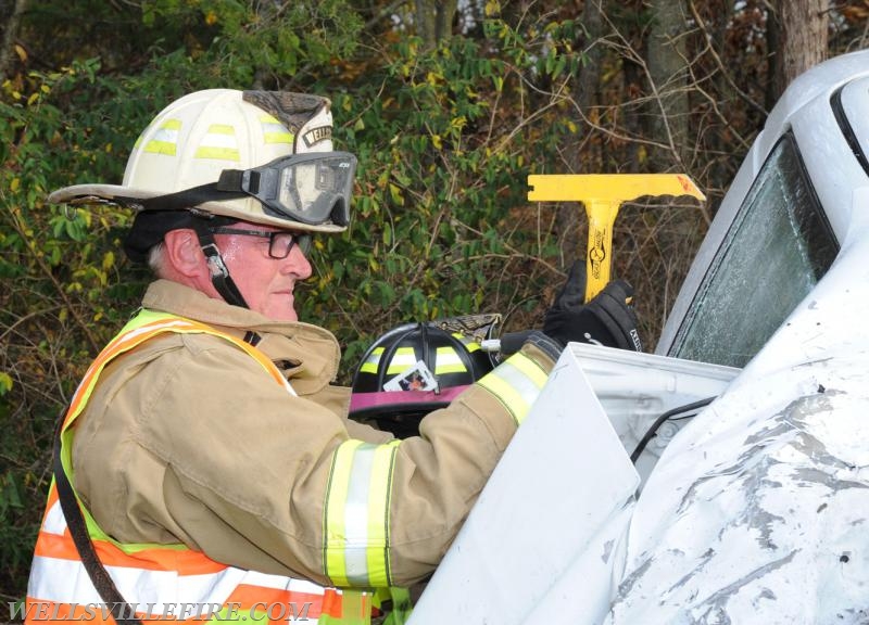 Two vehicle accident on Wellsville Road on 10/21/16.  Van on its side, driver entrapment.  photo by curt werner