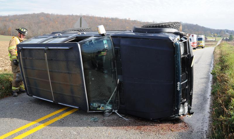 Vehicle on its side, Thursday, November 12, on Mt Zion Road.  photo by curt werner
