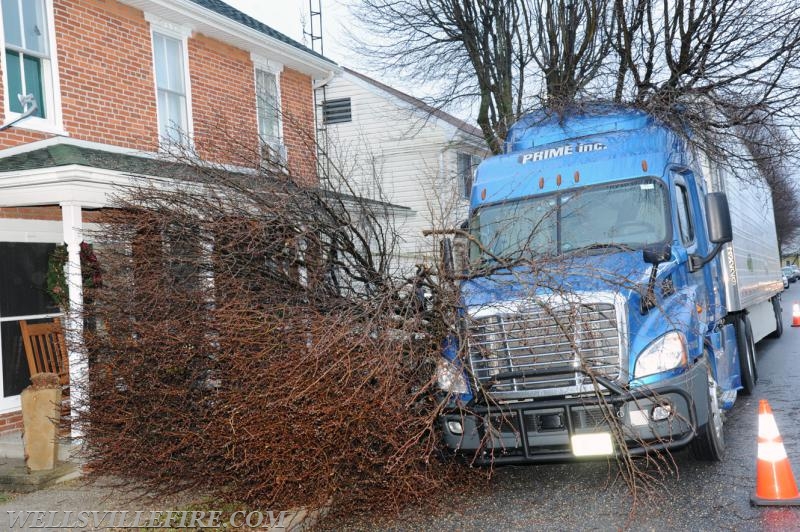 Tractor trailer hits tree into house on Main Street in Wellsville on Tuesday, January 3. photo by Curt Werner
