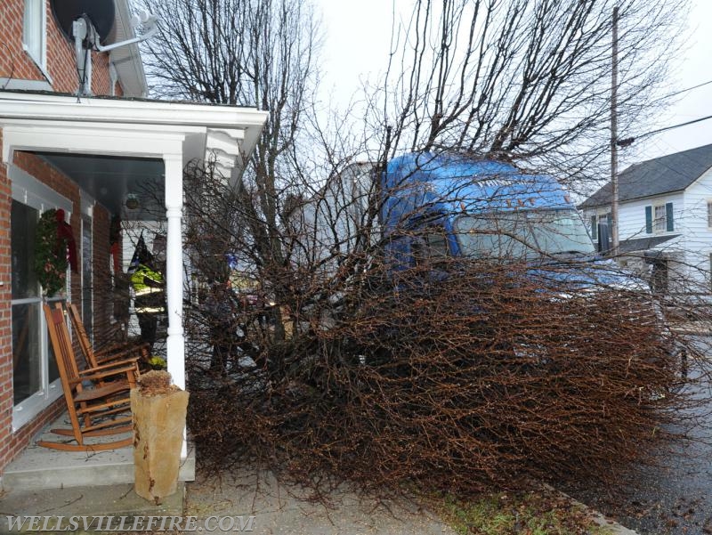 Tractor trailer hits tree into house on Main Street in Wellsville on Tuesday, January 3. photo by Curt Werner