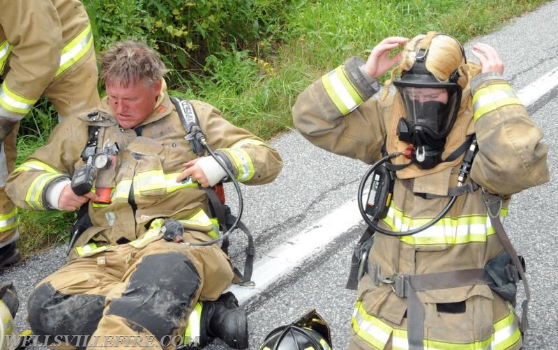 On Wednesday, June 15, a pickup truck caught on fire of Alpine Road.  Craig Harlacker and Alexus Kaylor worked the hose.  photo by curt werner