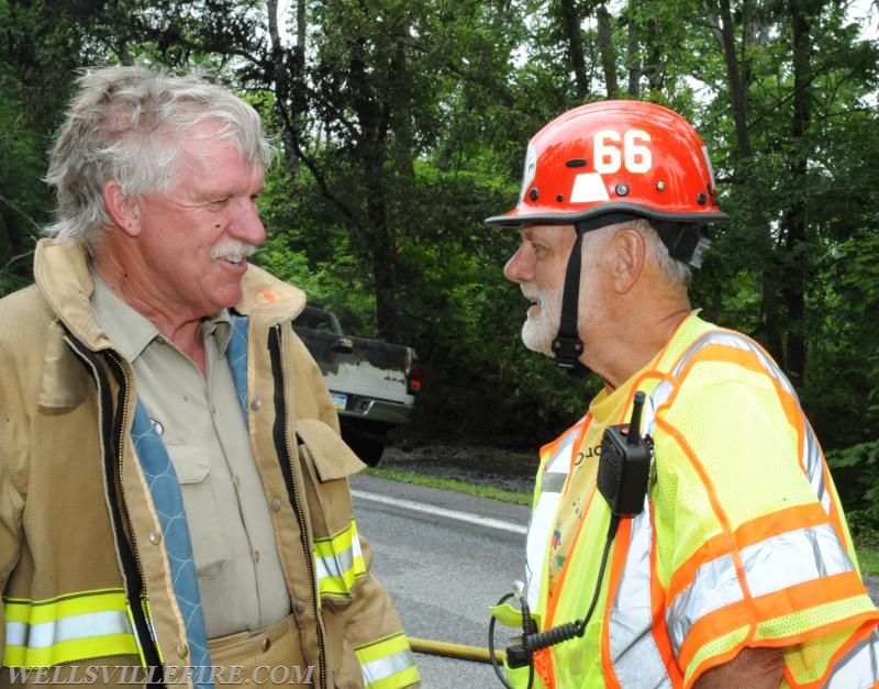 On Wednesday, June 15, a pickup truck caught on fire of Alpine Road.  Craig Harlacker and Alexus Kaylor worked the hose.  photo by curt werner