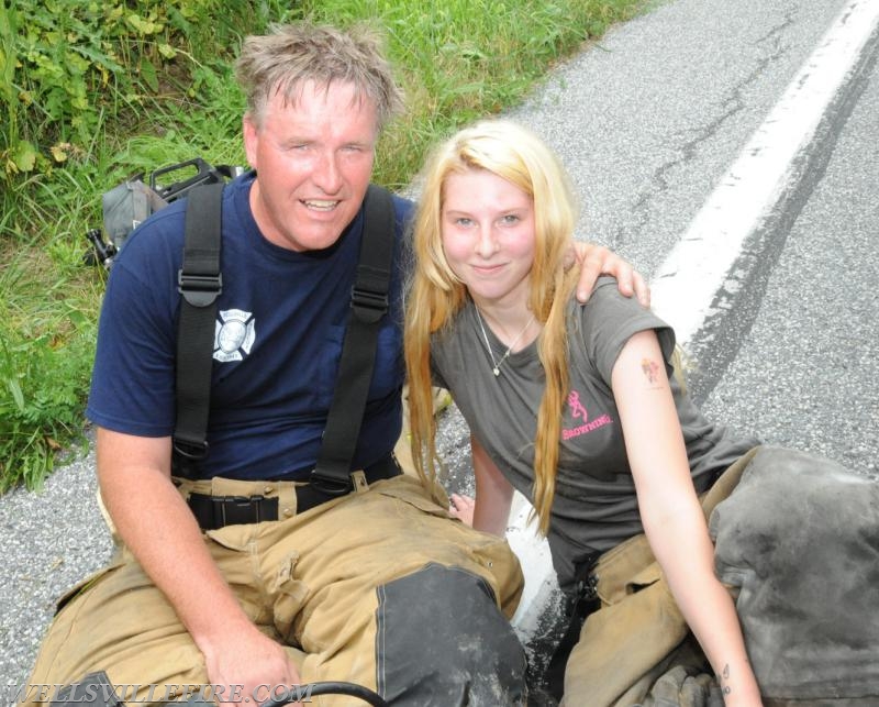 On Wednesday, June 15, a pickup truck caught on fire of Alpine Road.  Craig Harlacker and Alexus Kaylor worked the hose.  photo by curt werner