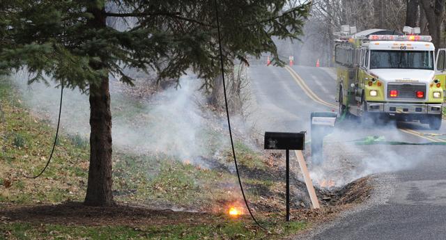 On Monday, April 14, a tree fell on wires, falling across Stone Jug Road catching brush on fire.