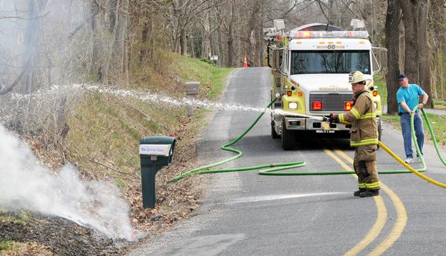 On Monday, April 14, a tree fell on wires, falling across Stone Jug Road catching brush on fire.