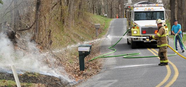 On Monday, April 14, a tree fell on wires, falling across Stone Jug Road catching brush on fire.