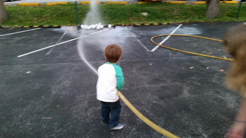 2014 Fire Prevention Night and Open House - Using a fire hose. 
Photo by J. Albert