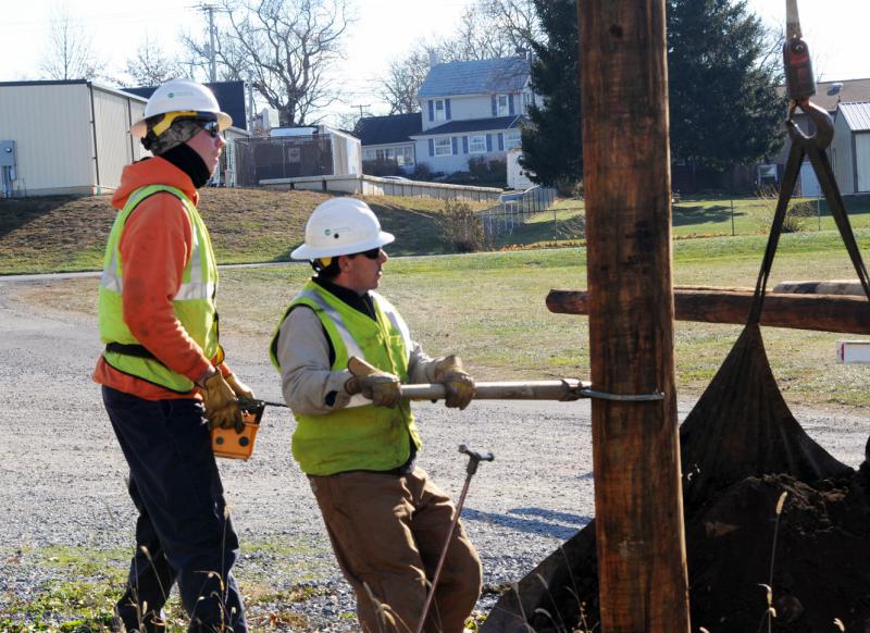 On Friday, November 21,  Adams Electric and volunteers put up telephone poles and under ground wiring for the new lightning.