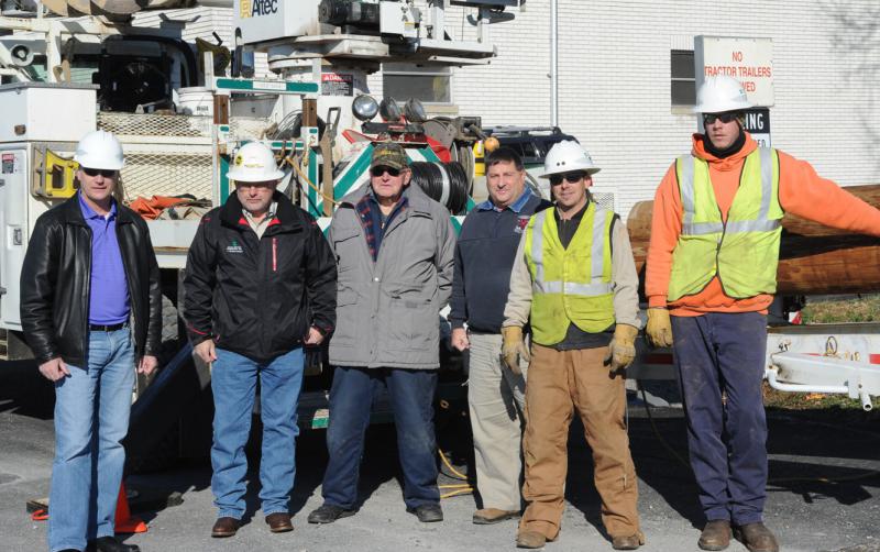 On Friday, November 21,  Adams Electric and volunteers put up telephone poles and under ground wiring for the new lightning.