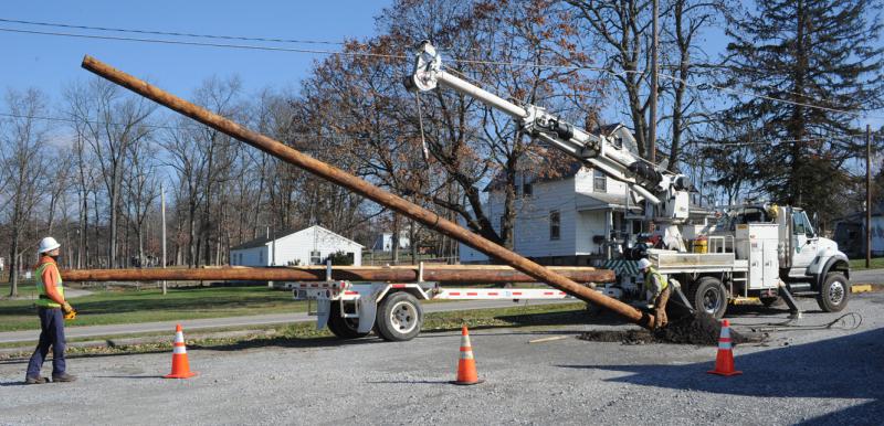 On Friday, November 21,  Adams Electric and volunteers put up telephone poles and under ground wiring for the new lightning.