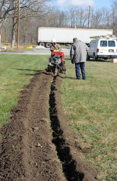 On Friday, November 21,  Adams Electric and volunteers put up telephone poles and under ground wiring for the new lightning.