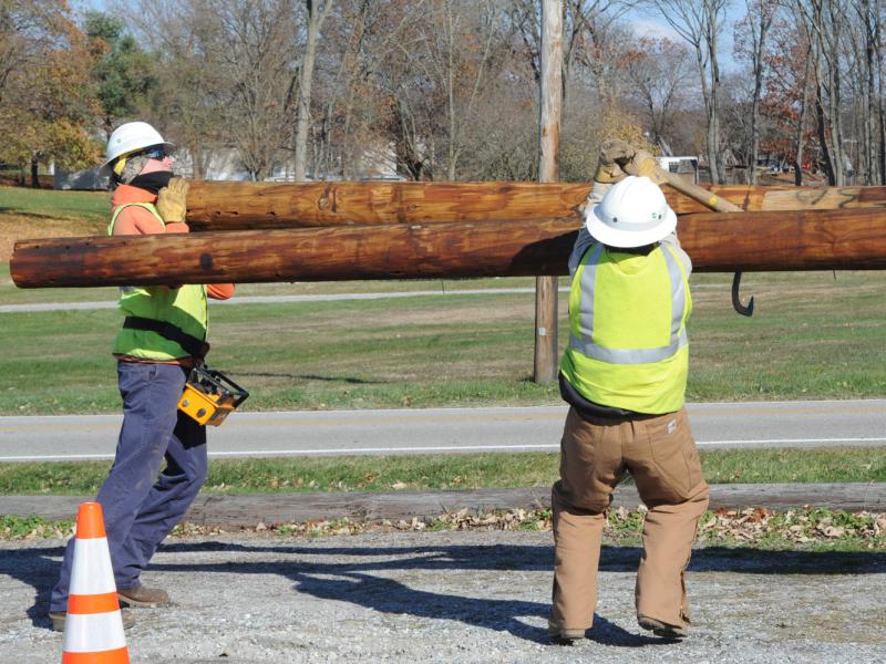 On Friday, November 21,  Adams Electric and volunteers put up telephone poles and under ground wiring for the new lightning.